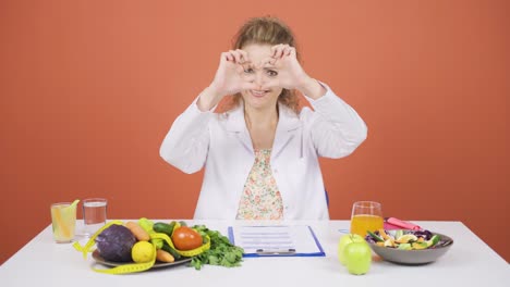 nutritionist dietitian doctor makes heart on camera. healthy lifestyle.