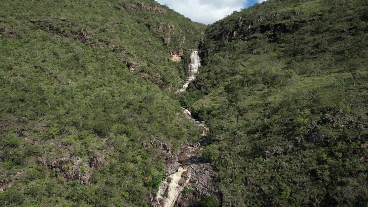 Catoá waterfall, large waterfall in Paranã Tocantins and Chapada dos Veadeiros Goias, Brazilian landscape, sunny day, trees, crystal clear and green water