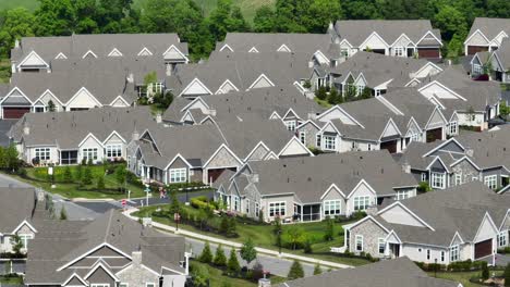 Panoramic-drone-view-of-multiple-townhomes-inside-of-a-private-gated-community