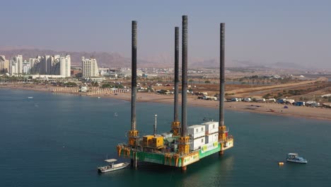 aerial-shot-of-natural-gas-field-in-sea-near-Israeli-coastline,-Hadatiyim-beach