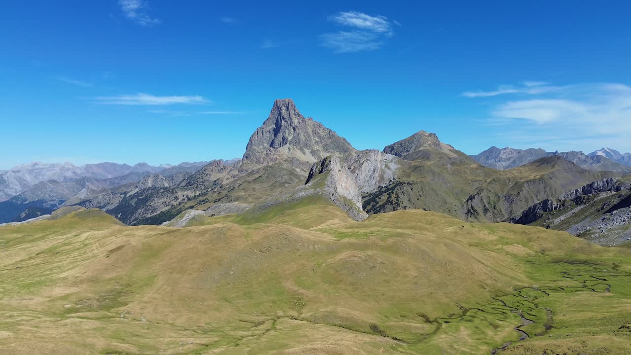 Majestic Midi d'Ossau mountain under clear blue sky, serene and vast landscape