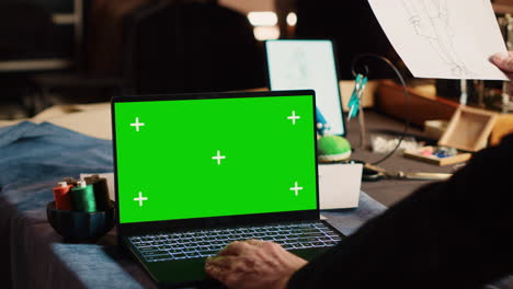 Craftsman-using-greenscreen-on-laptop