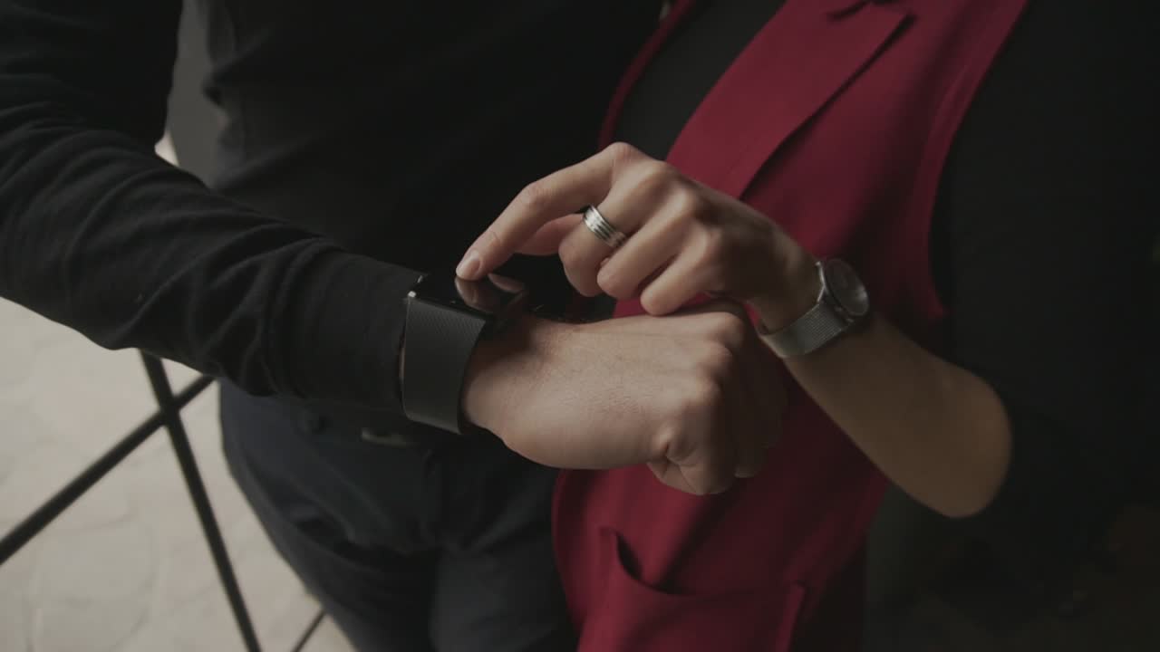 Couple Using Smartwatches