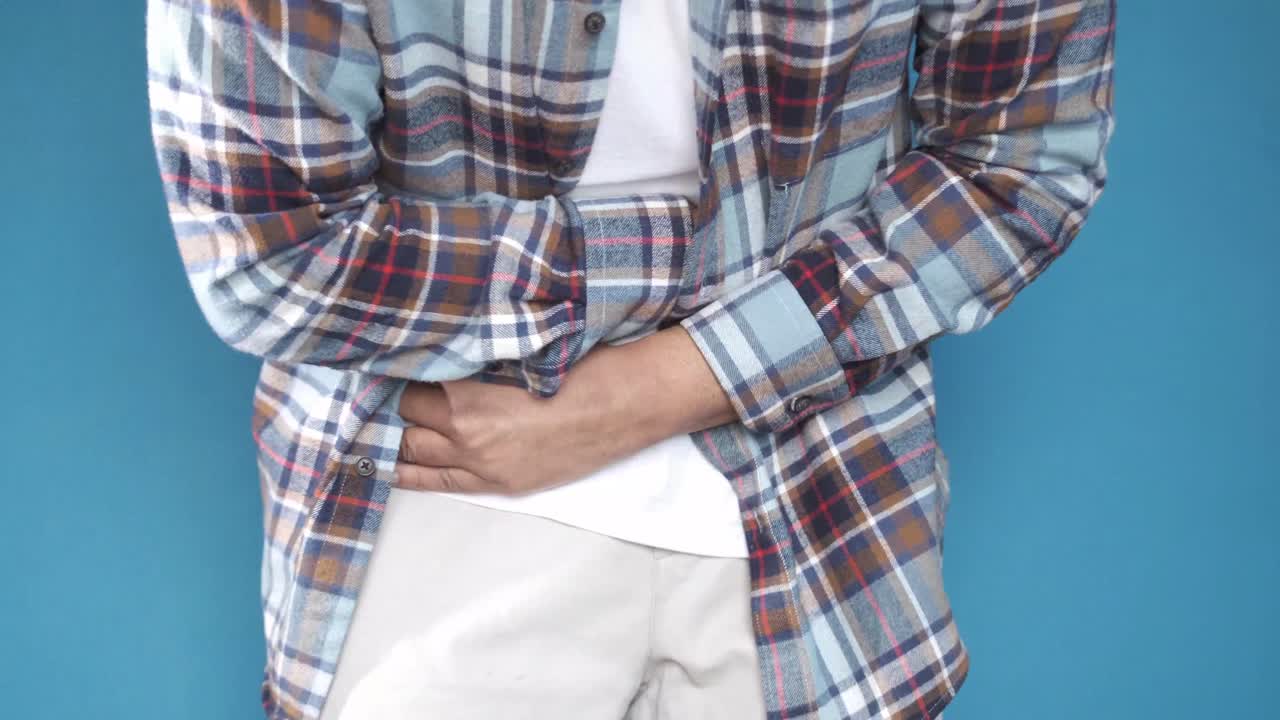Man Experiencing Stomach Pain