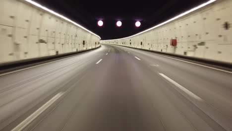 a hyper lapse shot from a motorcycle while driving in a tunnel