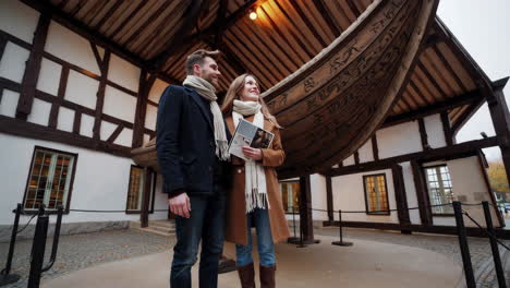 couple visiting a viking ship museum