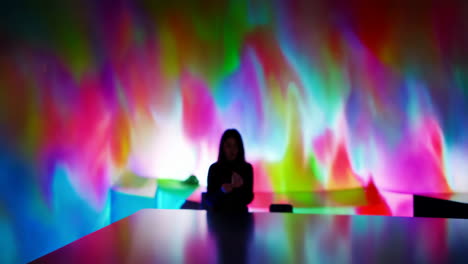 person in a colorful aurora display