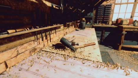 woodworking tools and shavings in a workshop during daylight hours