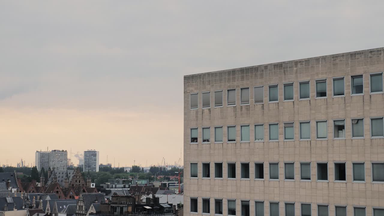 Pan shot of West Antwerp skyline, featuring Linkeroever and urban architecture at sunset shot in Antwerp City, Belgium