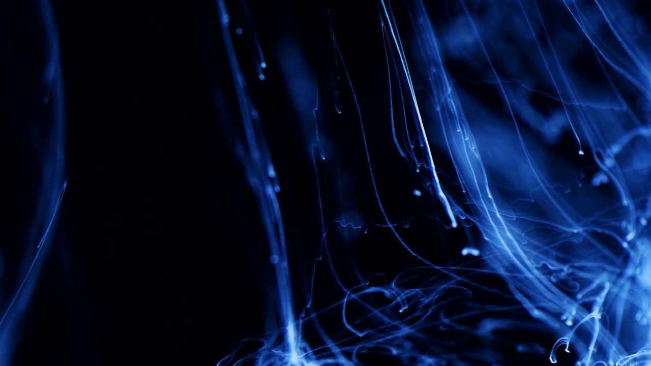 Shot of Ink Moves. Cosmic abstraction of a light blue particle ink. macro