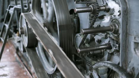 Old vintage loom, many rotating wheels