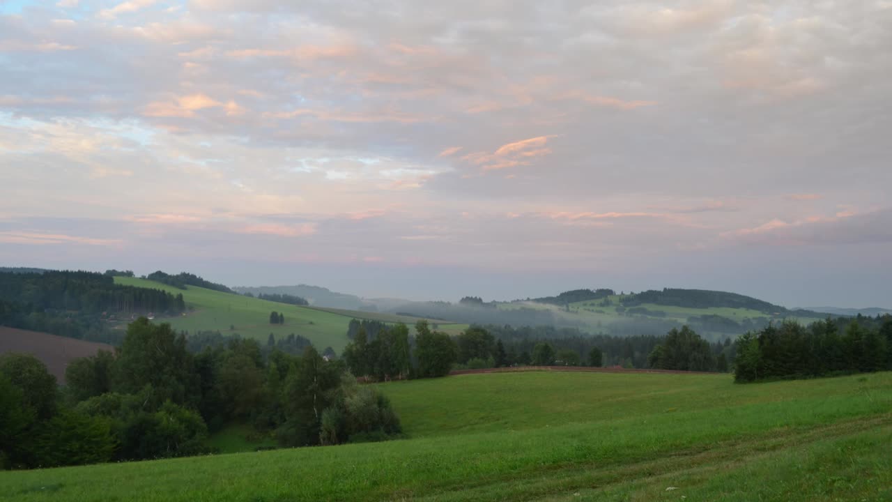 Timelapse of cloudy and foggy sunset in Ceskomoravská vrchovina mountains in Czech republic