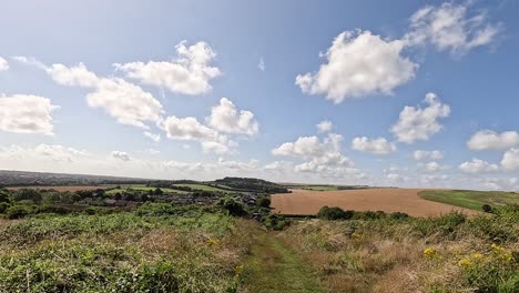 cloudy sky over lush green landscape