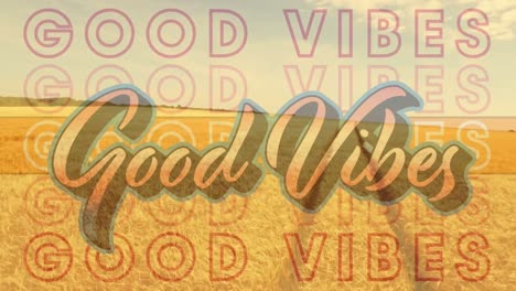 Digital-composition-of-good-vibes-text-against-view-of-grassland-landscape