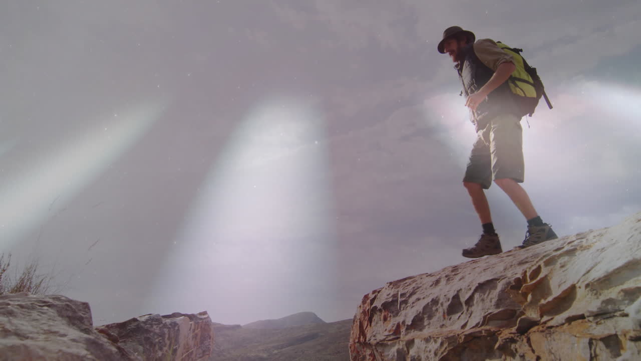 Male hiker stepping across rocky ledge in health training, with animated heart icon floating