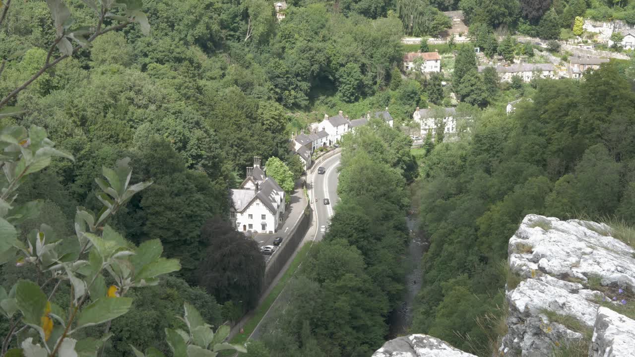 Traffic in a riverside valley village. Birds eye view, top view