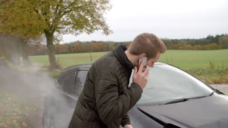 man calling to report car accident on country road