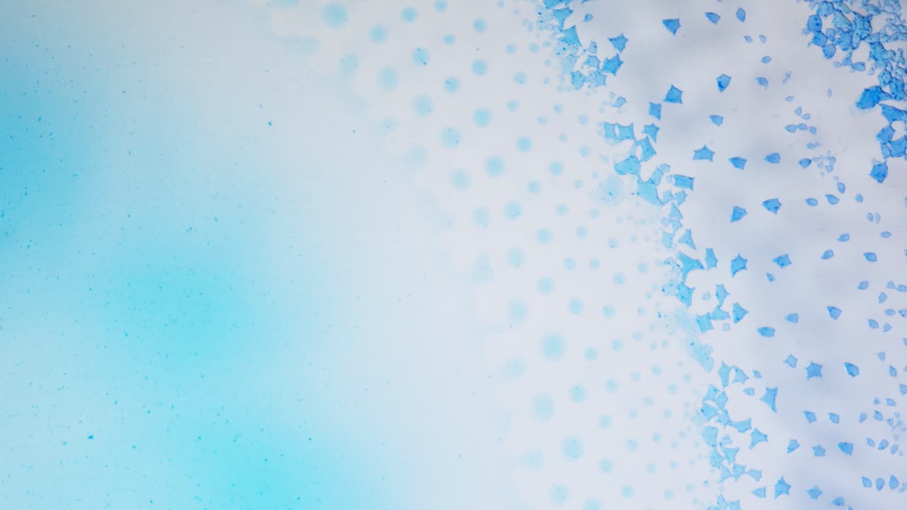 Abstract blue ink flowing in macro, dreamy and soft artistic texture in motion