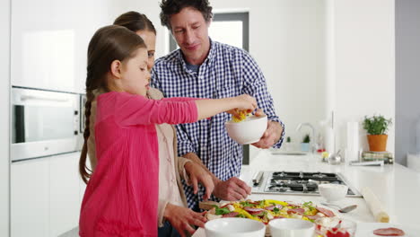 teaching her how to make the yummiest pizza