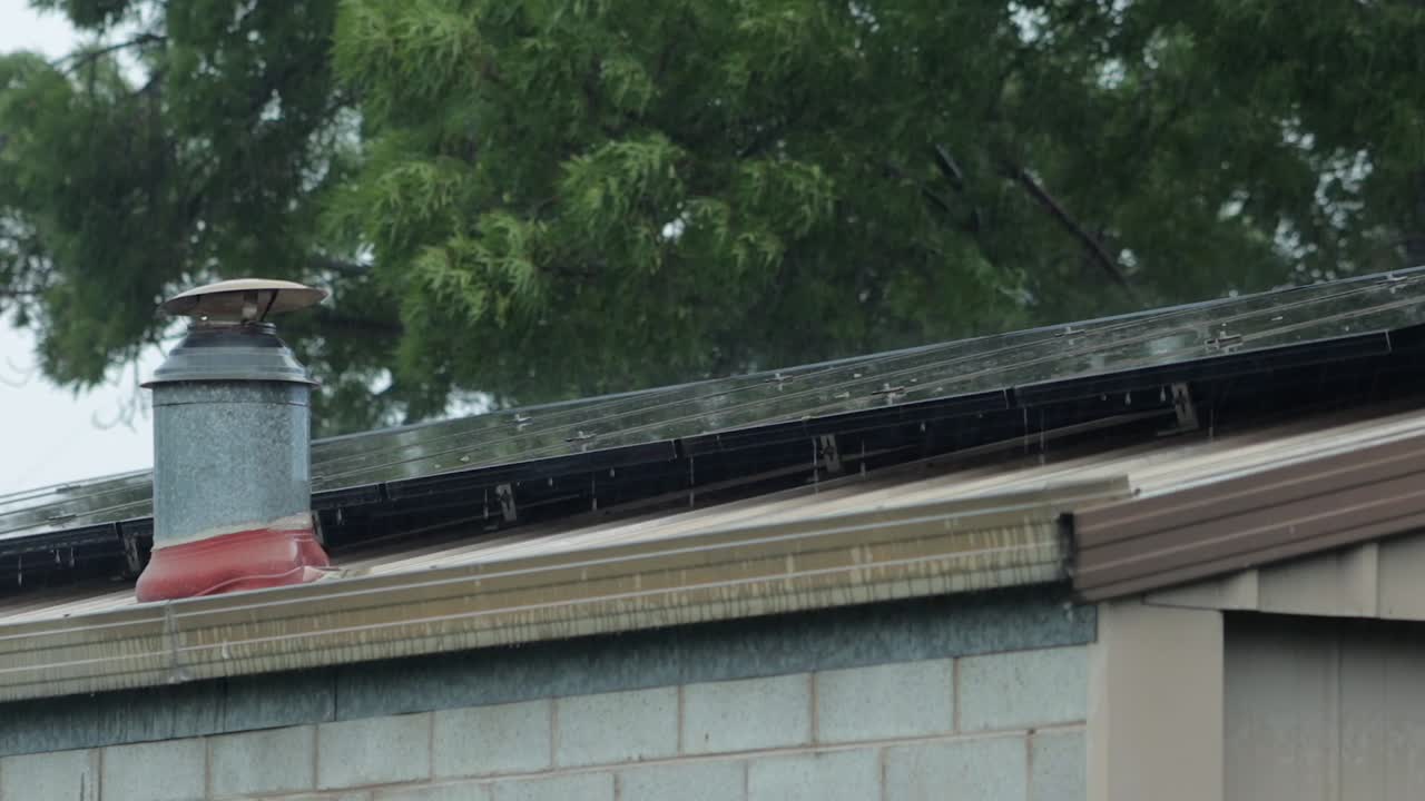Garage Shed Roof With Solar Panels and Chimney In Heavy Rain Storm Bad Weather, Daytime, Maffra, Gippsland, Victoria, Australia