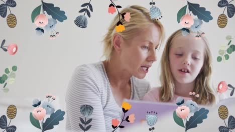 animación de flores sobre madre y hija caucásicas leyendo un libro en la cama