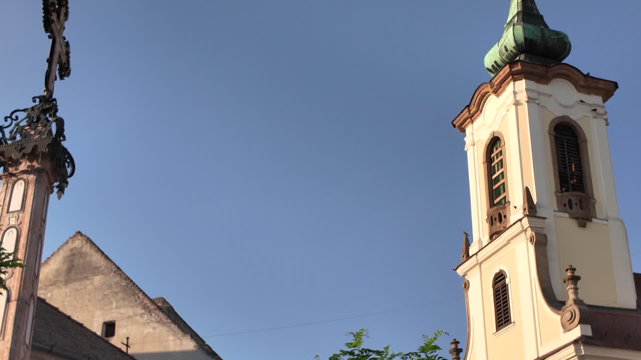 Blagovestenska Church and the Memorial Cross in Szentendre, highlighting the town’s religious heritage and historic charm