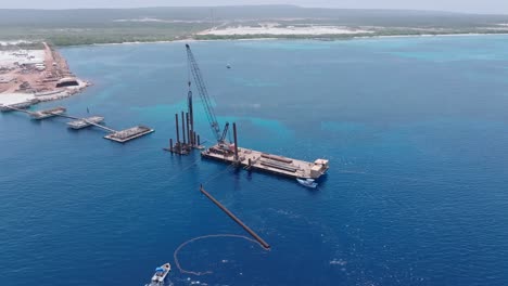 Aerial-view-orbiting-machinery-at-the-Puerto-Cabo-Rojo-port,-in-Dominican-Republic