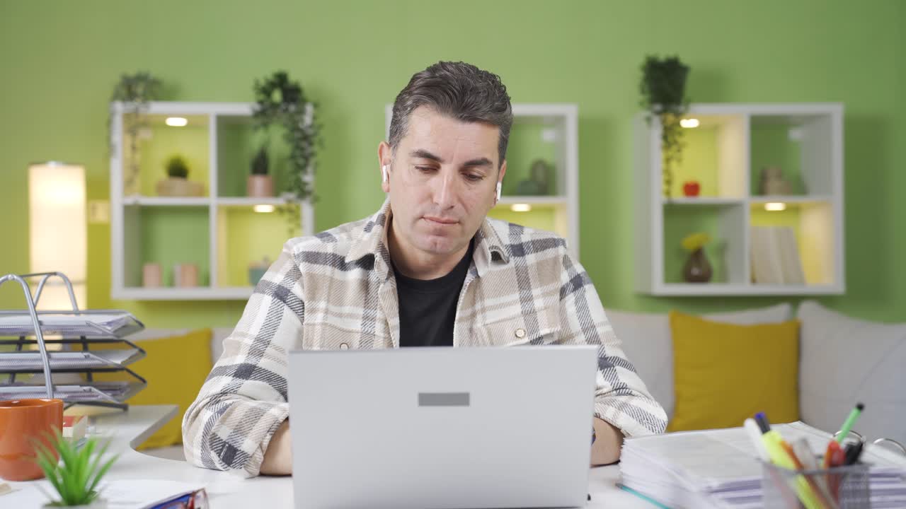 Thinking home office worker man comes up with a good idea.