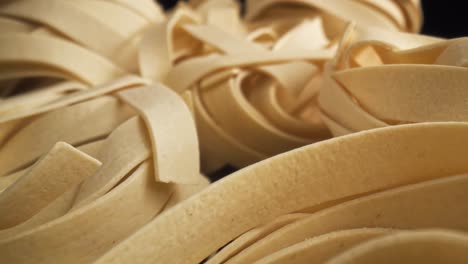 Zoom-in-macro-video-of-tagliatelle-pasta-rolls