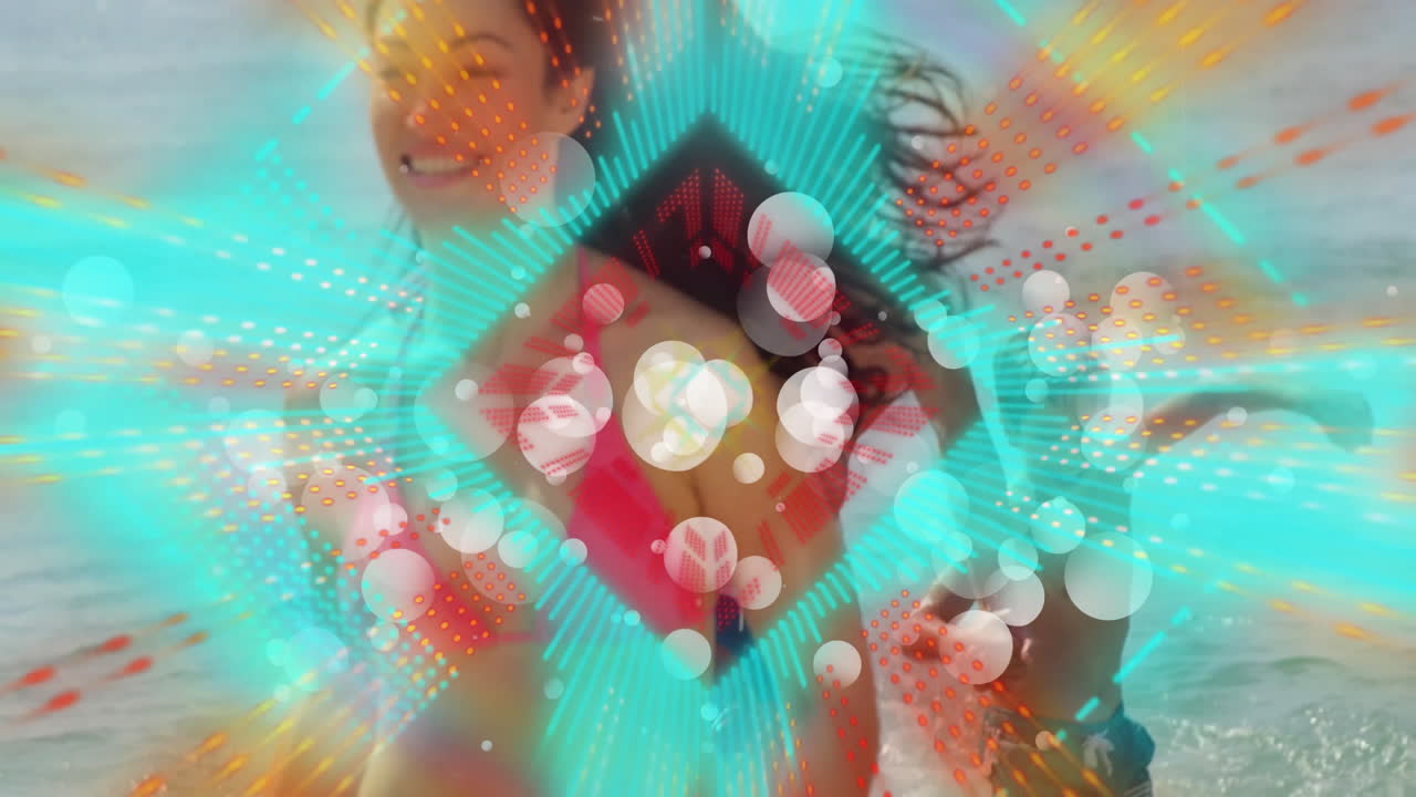 At beach, people relaxing with colorful abstract animation overlaying scene