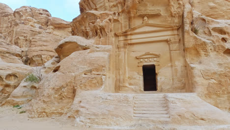 slow pan right of door of one of buildings in petra, jordan