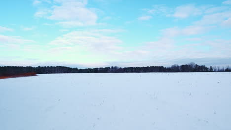 timelapse of snow covered field with partly cloudy skies