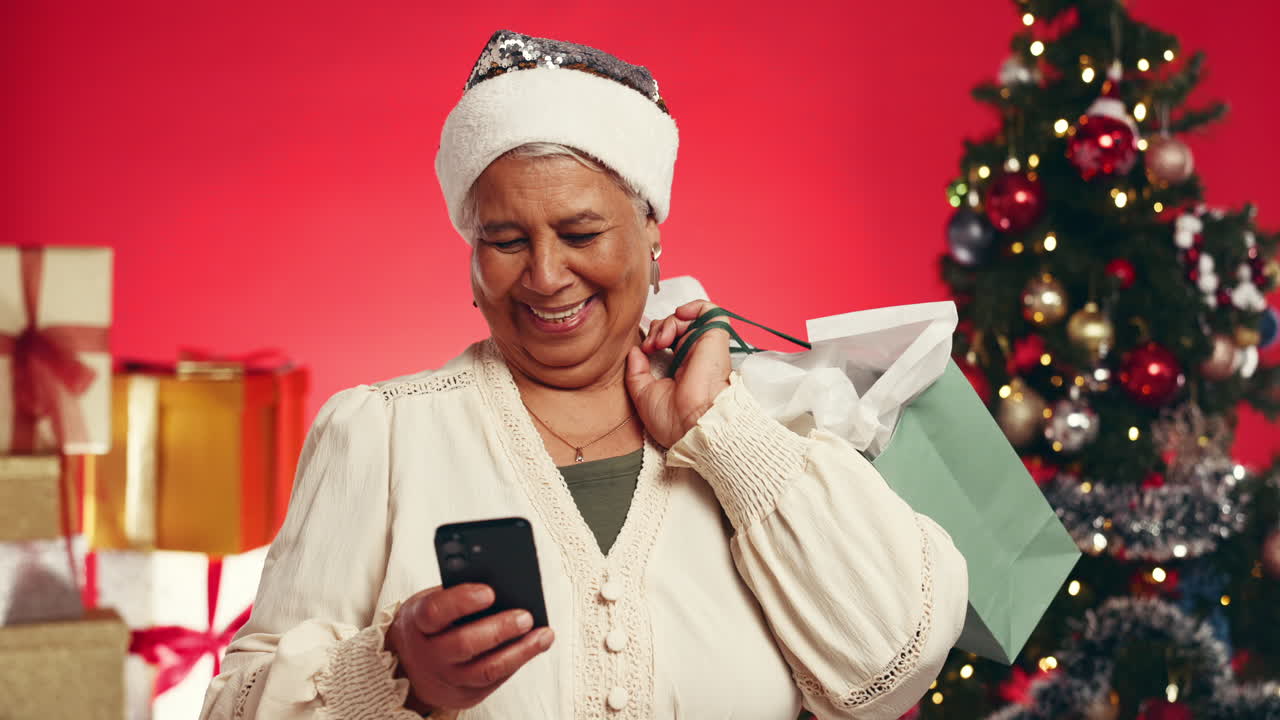 Festive Senior Woman Christmas Shopping with Smartphone