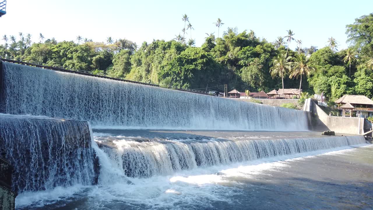 Long Horizontal Tropical Waterfall Water Flow in Klungkung Bali Indonesia, Tirai Air Terjun Tukad Unda Panoramic View, Balinese Travel and Tourism