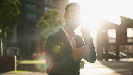 businessman talking on phone in city