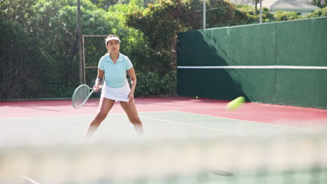 woman playing tennis on a court