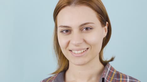 beautiful young girl smiling looking at camera.