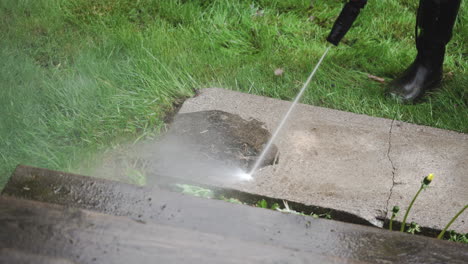 pressure washing a stone from dirt