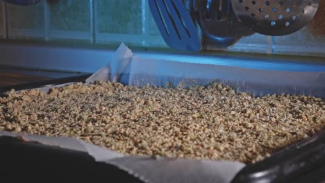 shredded mix veggies laid on a pan and topped with sesame seeds prepared for baking