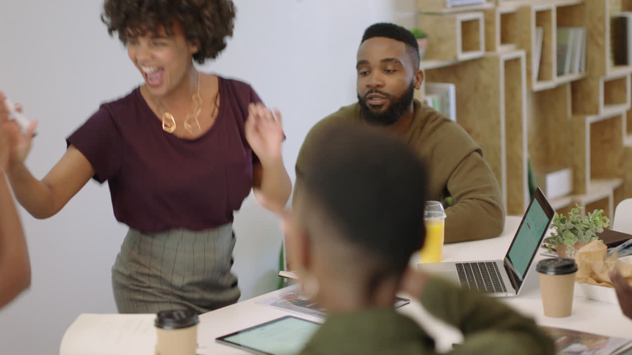 happy business people celebrating success enjoying corporate victory team leader woman excited dancing funny in boardroom presentation meeting top view