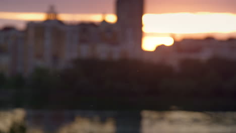 defocused cityscape at sunrise drone shot. blocks of flats in residential area.