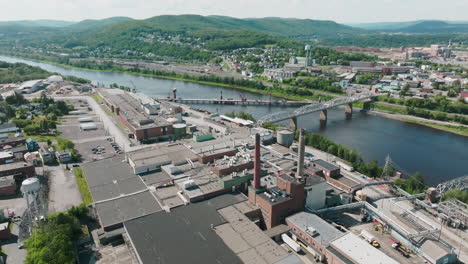 Drone-Highlights-Industrial-Plant-Nestled-on-the-Border-of-Maine,-USA-and-Edmundston,-Canda