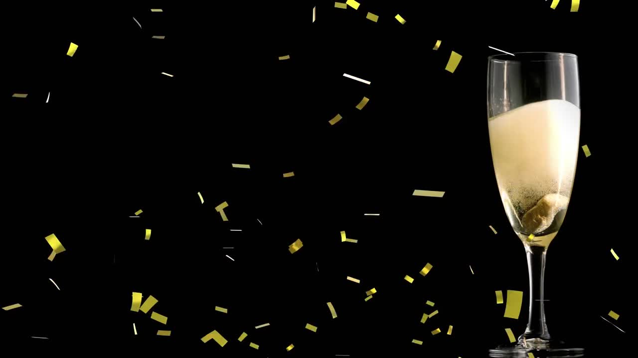 ⁇ 페인 잔 위에 떨어지는 금 콘페티의 애니메이션