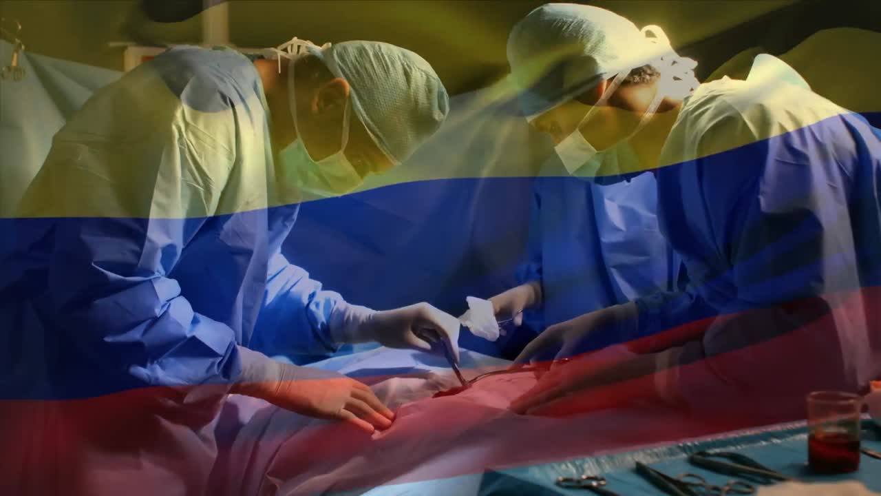 Animação da bandeira da Colômbia tremulando sobre cirurgiões em centro cirúrgico