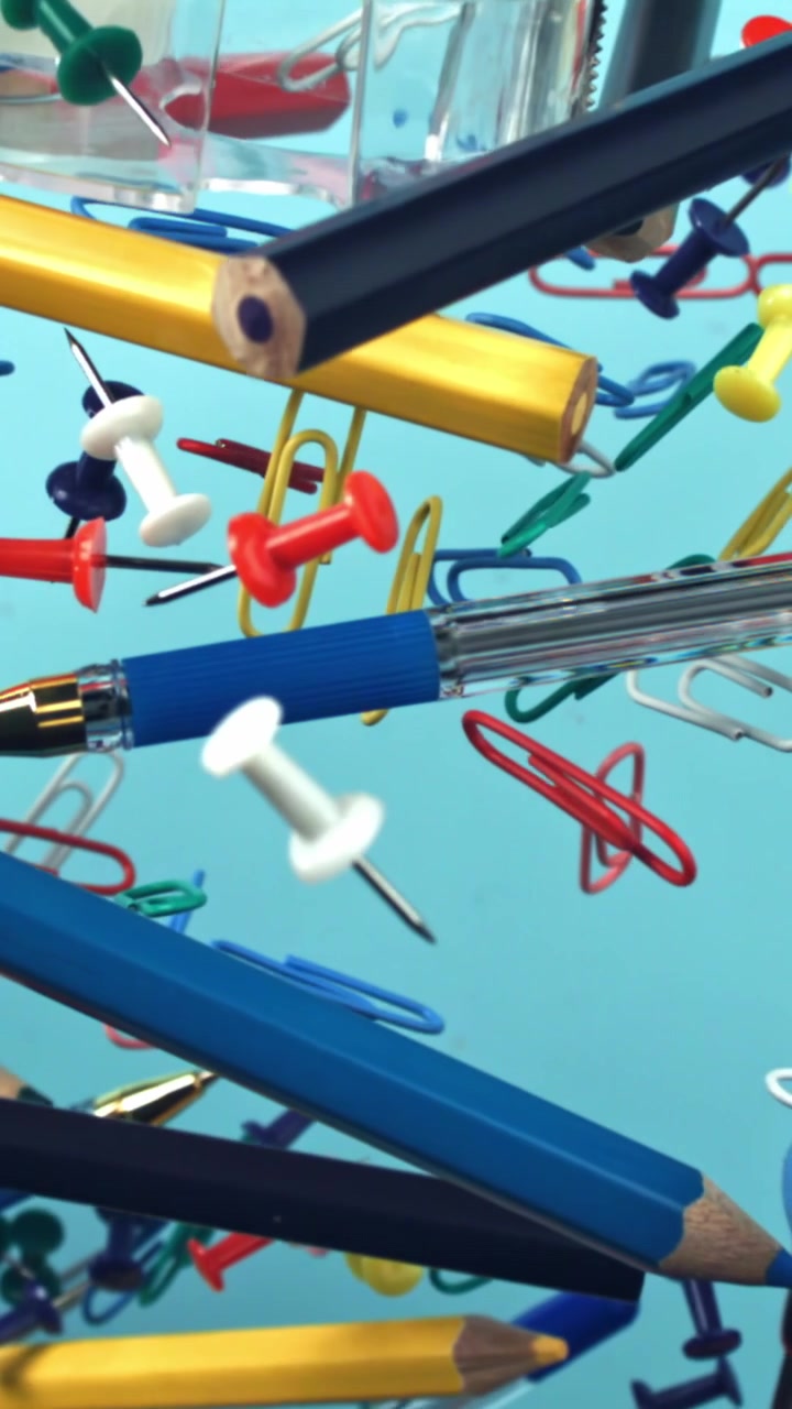 Colorful Office and School Supplies Floating in Slow Motion
