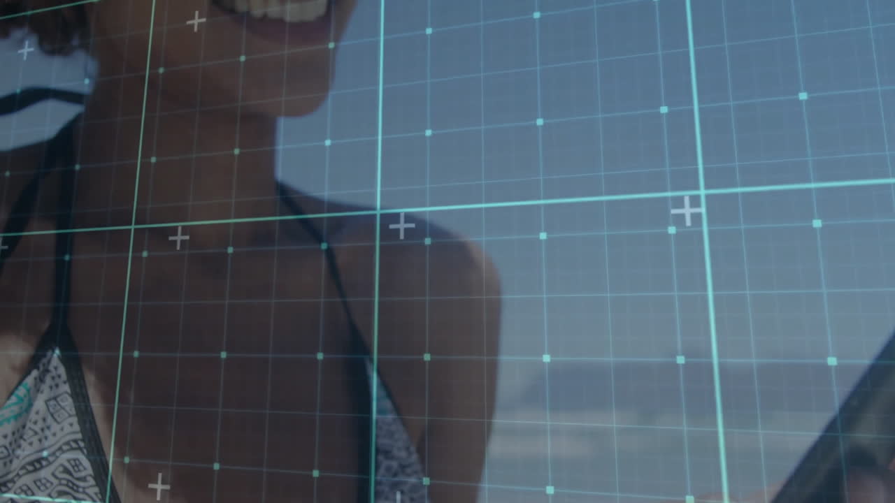 Using smartphone at beach, person with grid overlay animation on screen