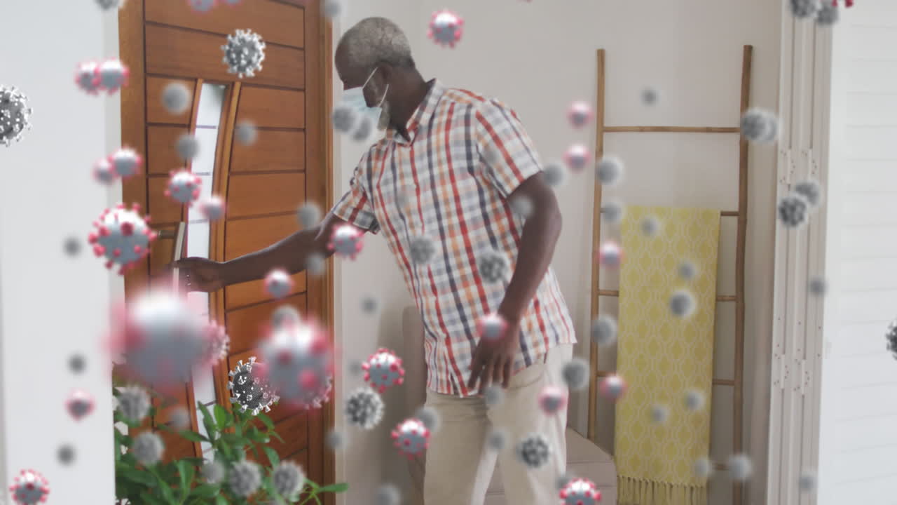 múltiples células de covid-19 flotando contra hombre afroamericano vistiendo médico de bienvenida en casa