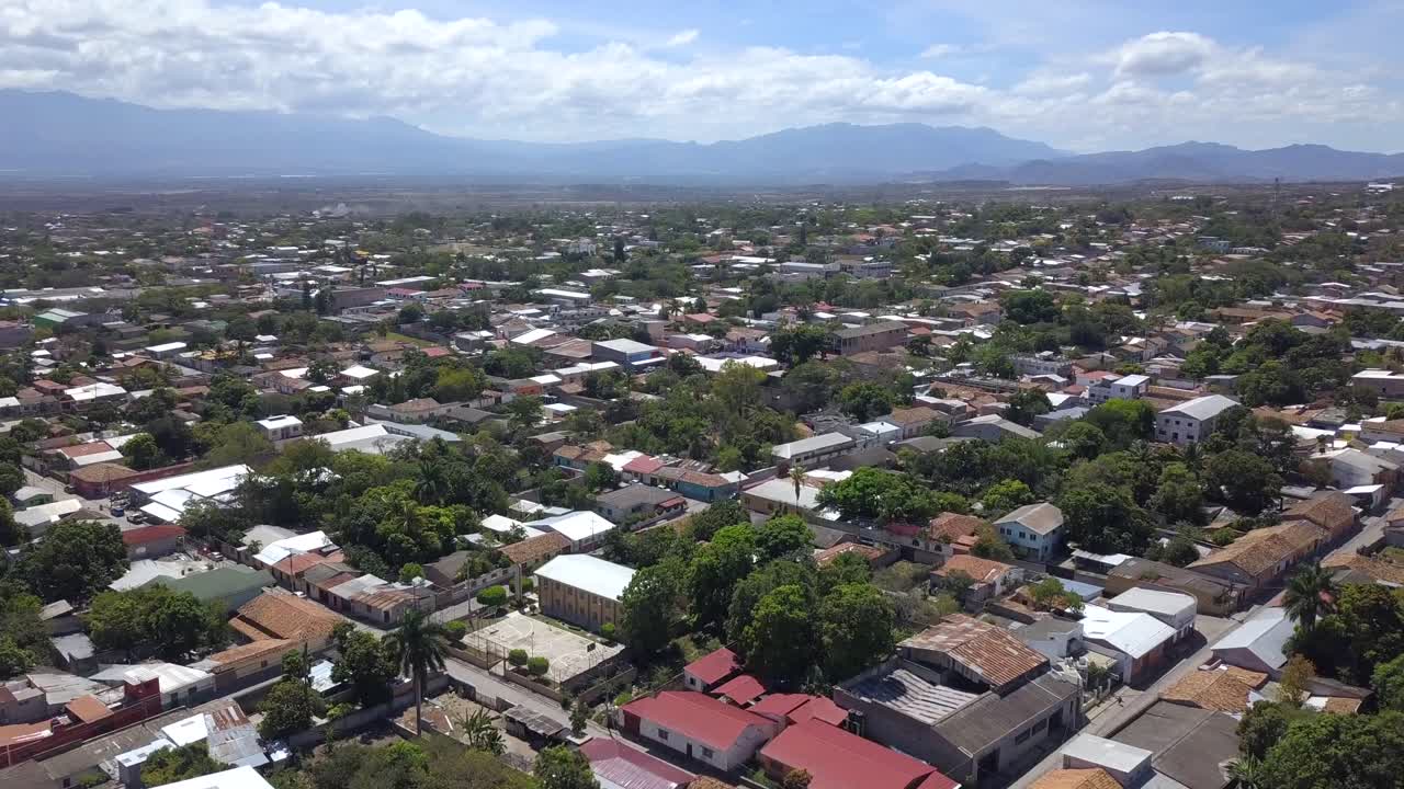 Drone shot of a town in Honduras with houses, urban and rural area