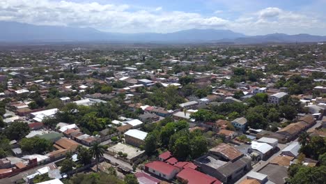 drone shot of a town in honduras with houses, urban and rural area