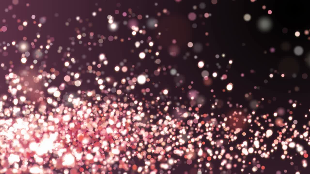 Rose gold glitter sparkles texture on dark background. Shiny abstract animation.
